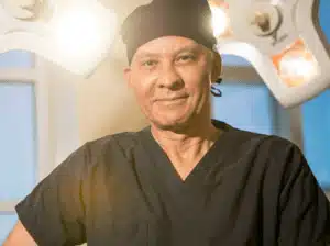 Dr. Delgado in scrubs