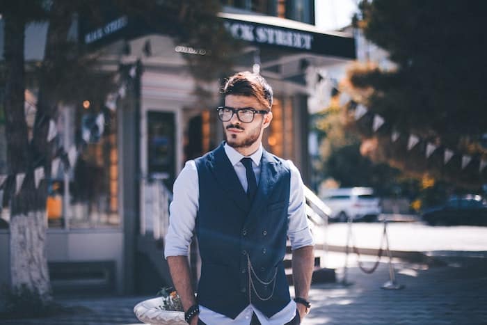 man walking outside dressed smartly