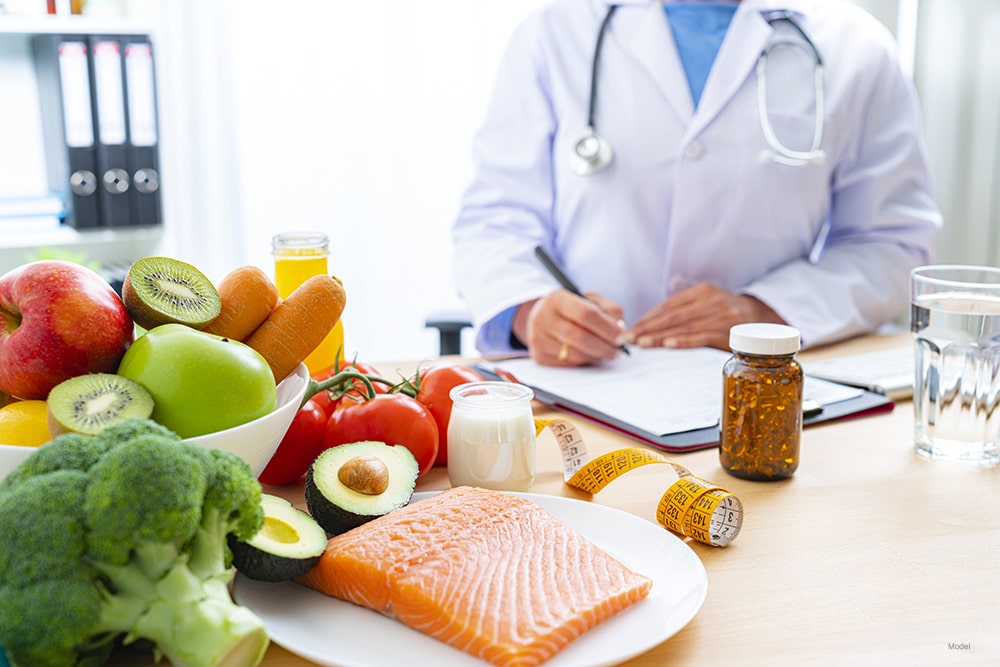 Nutritionist at office writing a diet plan